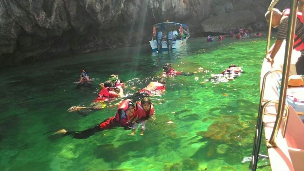 Snorkeling stop in clear green water